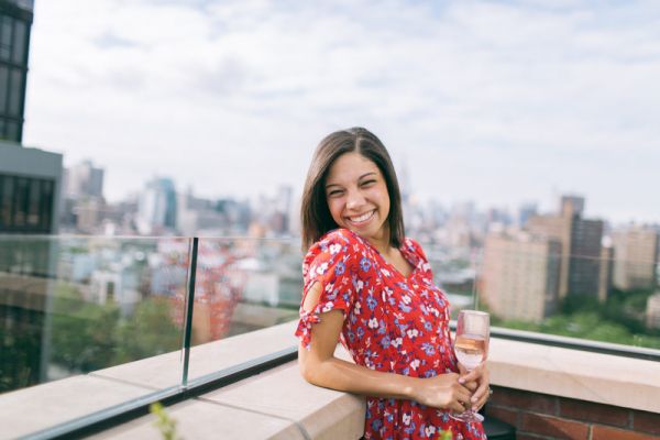 Canva Woman Wearing a Floral Dress with the a Rooftop View